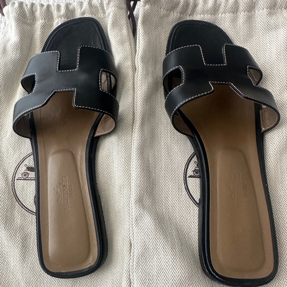 Authentic Hermés Oran Sandals in black.